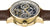 Herrenarmbanduhr im Profil mit braunem Lederband und goldfarbenem Gehäuse, Skelettwerk sichtbar