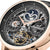 Cadran de montre pour homme avec affichage de la phase de lune et mouvement automatique visible dans un boîtier plaqué or rose