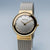Montre pour femme avec bracelet milanais argenté, boîtier doré et cadran blanc