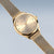 Montre Bering pour femme avec cadran beige et bracelet milanais, aiguilles dorées