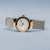 Montre pour femme avec bracelet milanais argenté et côtés dorés, cadran blanc
