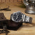 Seiko 5 Sports Herrenuhr mit schwarzem Zifferblatt und Metallarmband, Datum