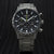 Montre chronographe pour homme avec cadran noir, trois sous-cadrans, bracelet en acier inoxydable