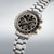 Herrenarmbanduhr mit Tachymeter-Lünette, schwarzem Zifferblatt und Edelstahlband