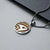 Collier avec pendentif rond en argent et design doré en forme d'étoile