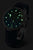 Bracelet de montre pour femme avec cadran sombre et index verts lumineux, bracelet noir