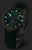 Montre Vostok Europe pour femme avec bracelet en cuir vert, boîtier rond et index luminescents