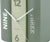 Horloge de table design livre avec chiffres 12 et 6, surfaces et aiguilles couleur menthe