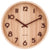 Horloge murale ronde en bois clair avec chiffres et aiguilles noirs