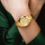 Festina Damen-Armbanduhr goldfarben am Handgelenk, weißes Zifferblatt, Datumsanzeige