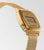 Damenuhr mit goldfarbenem Gehäuse und Mesh-Armband, seitliche Ansicht mit Alarm-/Timer-Display