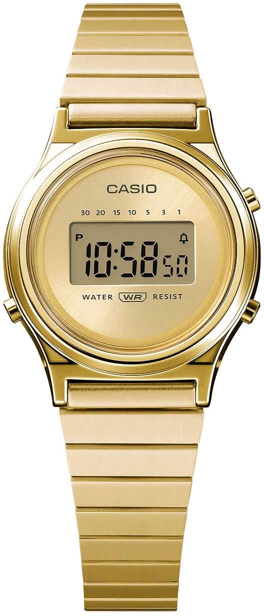 Montre Casio pour femme dorée : cadran numérique rond avec inscription WR-Resist et bracelet en métal