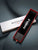Uhrenbox mit MONDAINE Swiss Watch Aufdruck, schwarze Samt-Einlage und SAMPLE