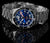 Montre pour homme Marc and Sons avec cadran bleu, bracelet en acier inoxydable et lunette réfléchissante.