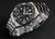 Herren-Diver-Uhr mit schwarzem Zifferblatt, orange Markierungen und Stahlarmband