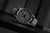 Montre Mondaine stop2go pour homme avec cadran blanc, boîtier gris et bracelet en cuir gris.