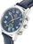 Montre femme : cadran bleu avec « FR », aiguilles jaunes, boîtier en acier et bracelet en cuir bleu