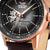 Montre homme : cadran noir avec mouvement apparent et aiguilles couleur or rose
