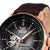 Montre homme avec lunette couleur or rose, cadran noir et bracelet en cuir foncé