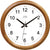 Horloge murale ronde en bois avec cadran blanc, aiguilles noires et logo JVD.