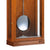 Horloge murale en merisier avec ouverture métallique ronde et façade en verre en partie inférieure