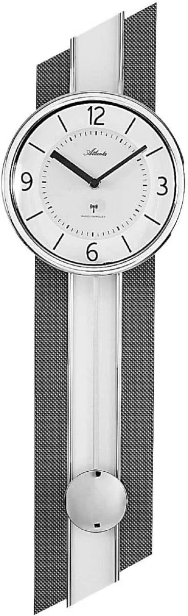 Horloge murale avec cadran rond, chiffres romains et poids de pendule visible