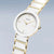 Bering Montre Femme avec bracelet en céramique blanche et accents dorés, cadran rond