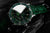 Montre de plongée avec cadran vert, index luminescents et lunette argentée