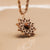 Collier avec chaîne en or rose et pendentif soleil en bois de noyer, en forme d'étoile