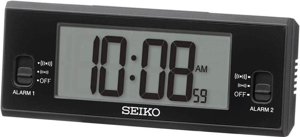 Réveil numérique avec boîtier noir, affichage lumineux 10:18 AM et inscription SEIKO