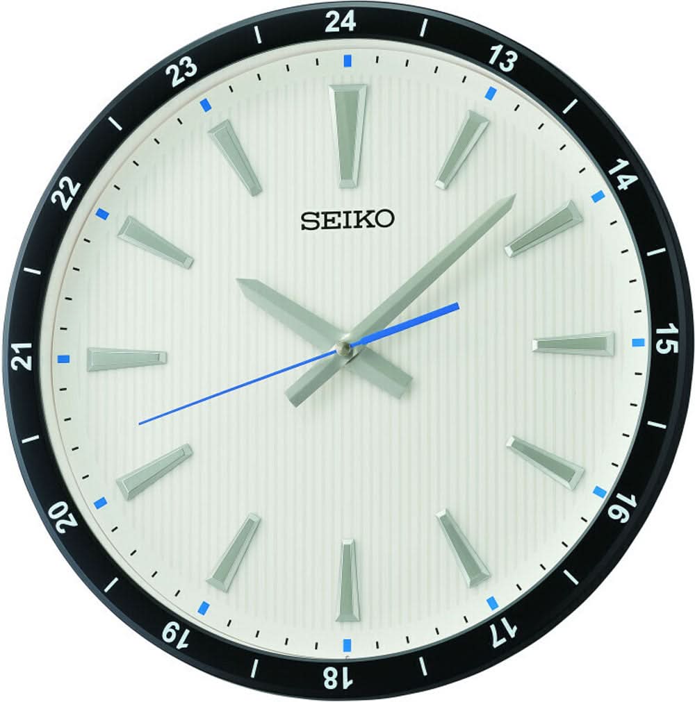 Horloge murale avec cadran Seiko, bordure beige et échelle des minutes noire