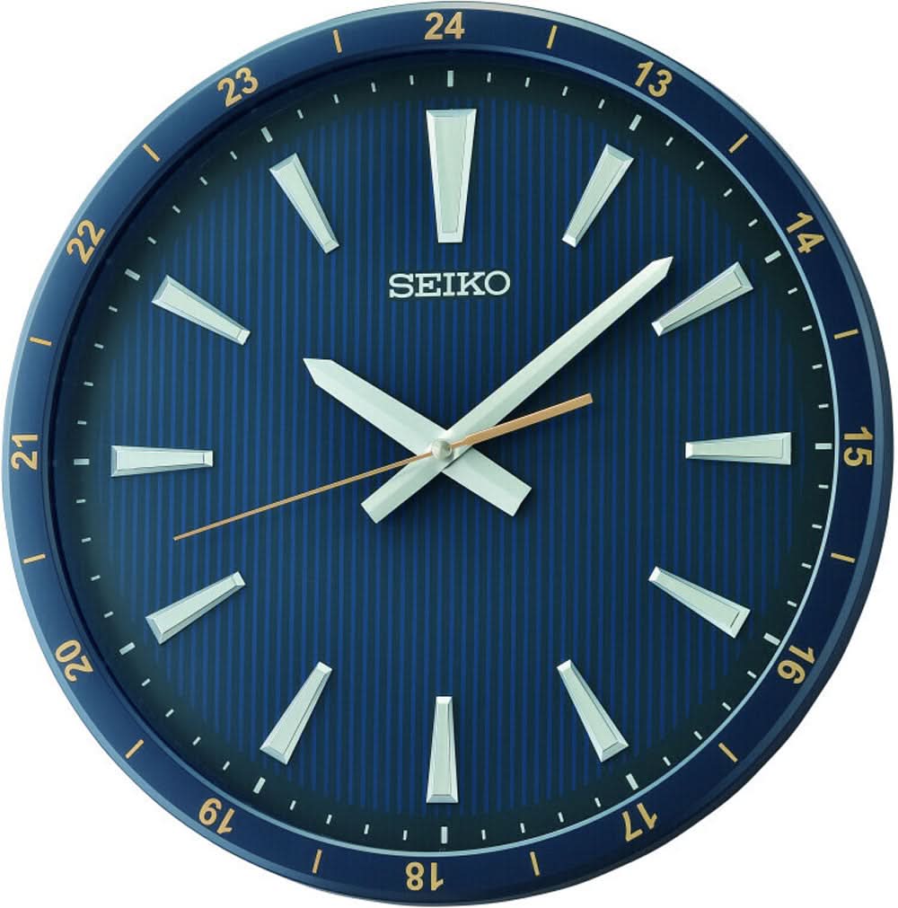 Cadran bleu de l'horloge murale Seiko avec aiguilles blanches, index et inscription SEIKO