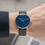 Herrenarmbanduhr: blaues Zifferblatt, schwarzes Lederband, silbernes Gehäuse