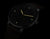 Montre homme avec cadran noir, index luminescents et aiguilles colorées