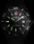 Herrenuhr mit schwarzem Zifferblatt, rotem Kreuz-Emblem und grünen Leuchtmarkern