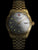Herrenautomatikuhr Swiss Military Hanowa mit goldenem Metallarmband und dunklem Zifferblatt