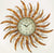 Horloge murale avec design soleil doré et cadran rond