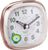 Réveil analogique avec contour or rose, chiffres lumineux verts et affichage LED