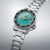 Montre de sport avec cadran vert, bracelet en acier inoxydable, lunette noire et guichet date LUN 6