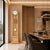 Enfilade en bois clair avec cadran rond, barres sonores et boule blanche