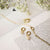 Boucles d'oreilles ANIA HAIE avec créoles dorées et pendentif perle