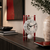 Horloge squelette avec cadran rond blanc, mouvement d'aiguilles noir et barres rouges