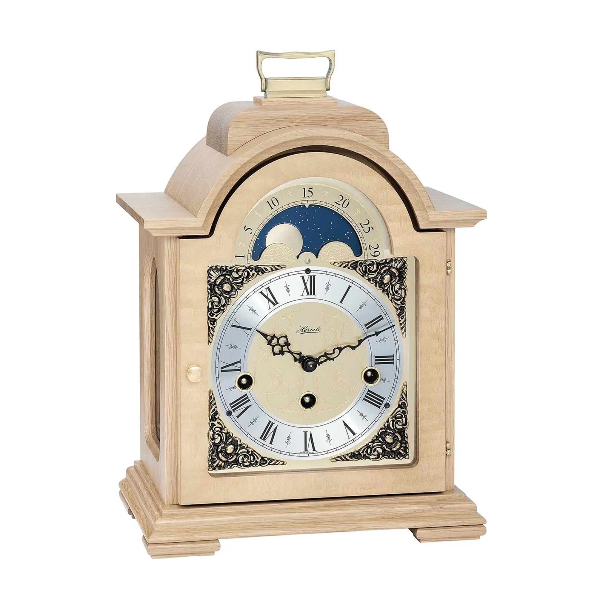 Horloge de table en bois clair avec cadran à phases lunaires et chiffres romains