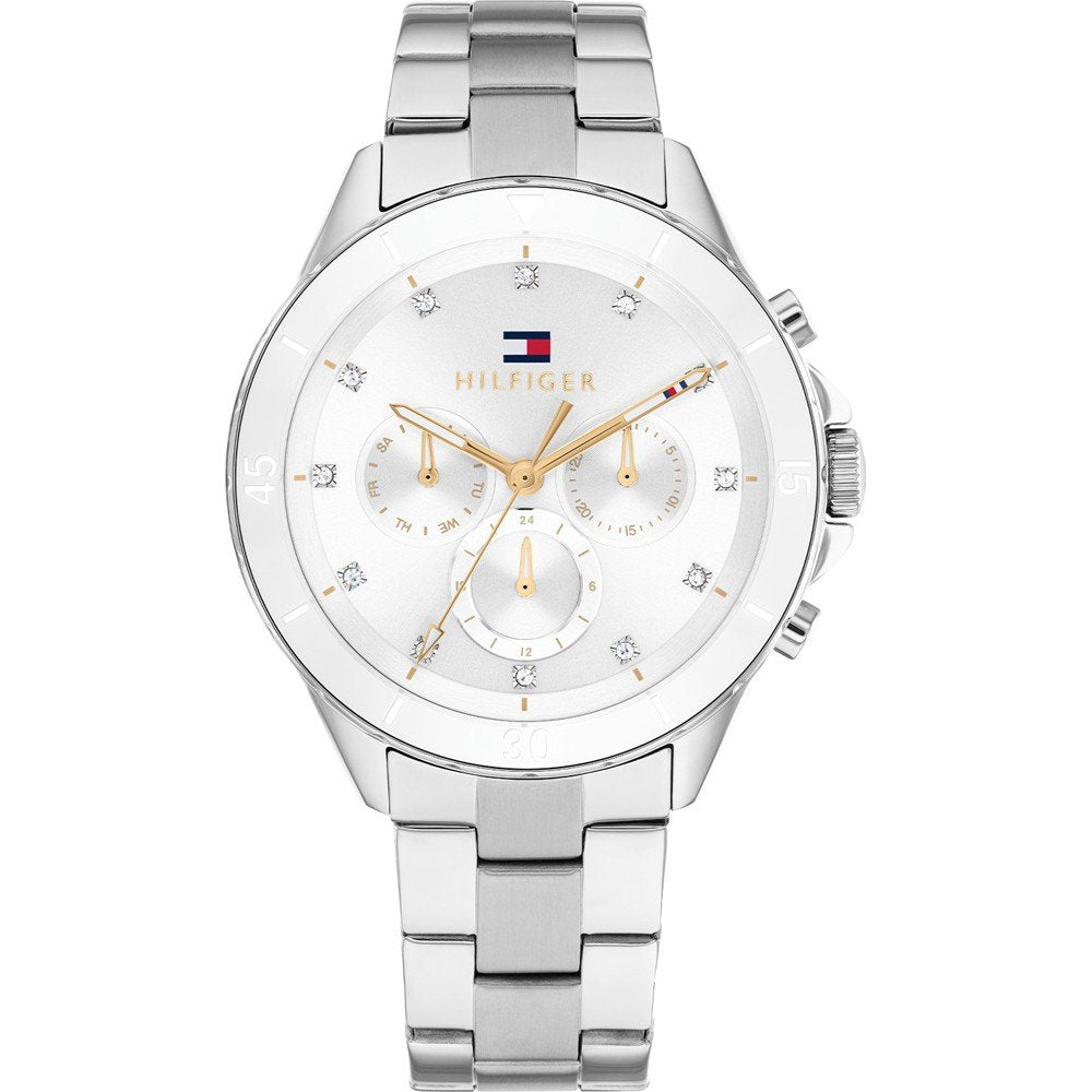 Tommy Hilfiger Damenarmbanduhr mit silbernem Metallband, rundem Gehäuse und weißem Zifferblatt.