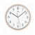 Horloge murale avec bordure beige, cadran blanc, aiguilles noires et symbole radio