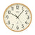 Horloge murale avec cadran beige, chiffres et aiguilles noirs, et cadre en bois clair.