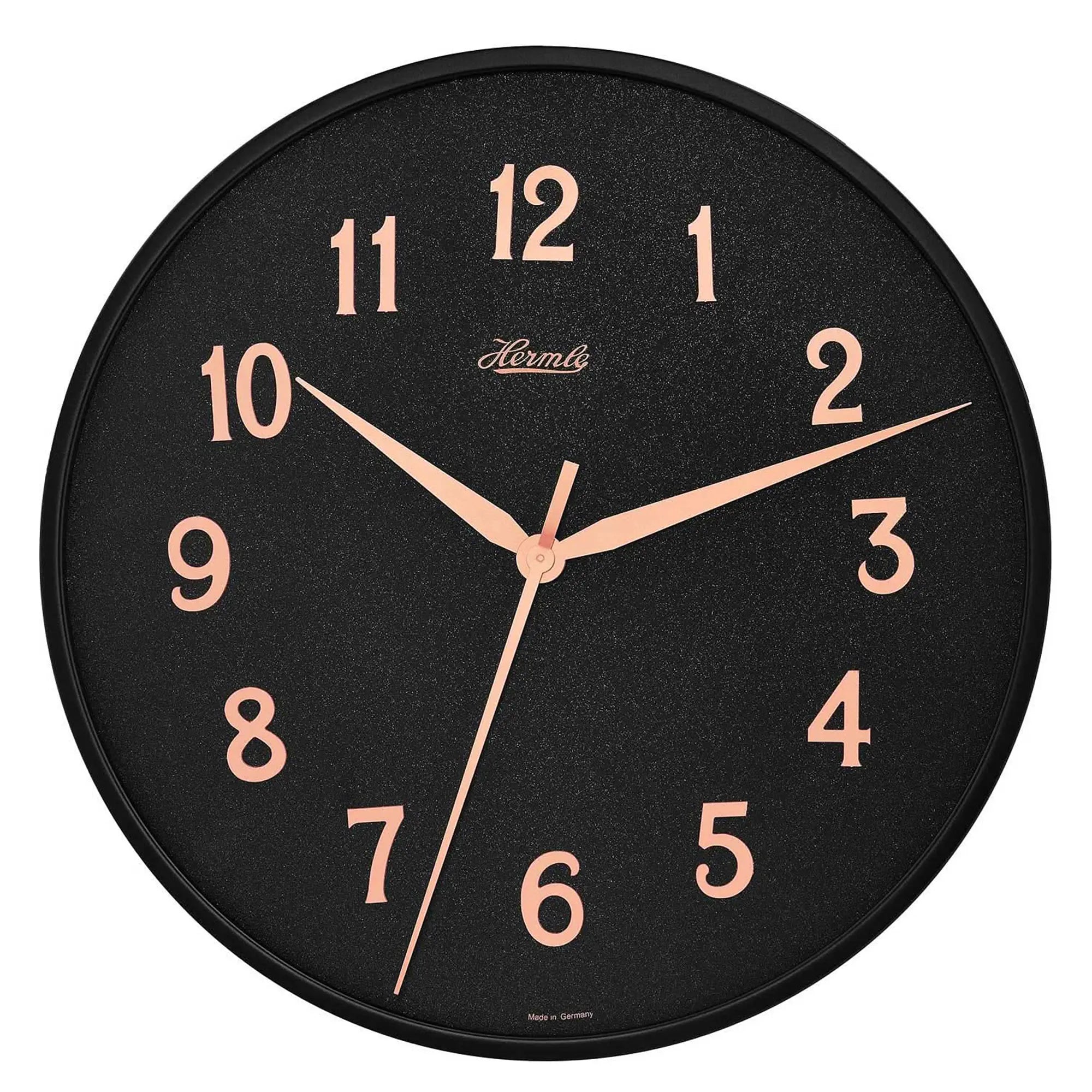 Horloge murale ronde : cadran noir, aiguilles et chiffres or rose, inscription Hermle