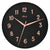 Horloge murale ronde : cadran noir, aiguilles et chiffres or rose, inscription Hermle