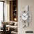 Wanduhr mit weißem Zifferblatt, schwarzen Zeigern und Holz-Alu-Rückwand, AMS-Logo
