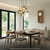 Holzwanduhr mit rundem weißem Zifferblatt, rechteckigem Gehäuse und sichtbarem Pendel